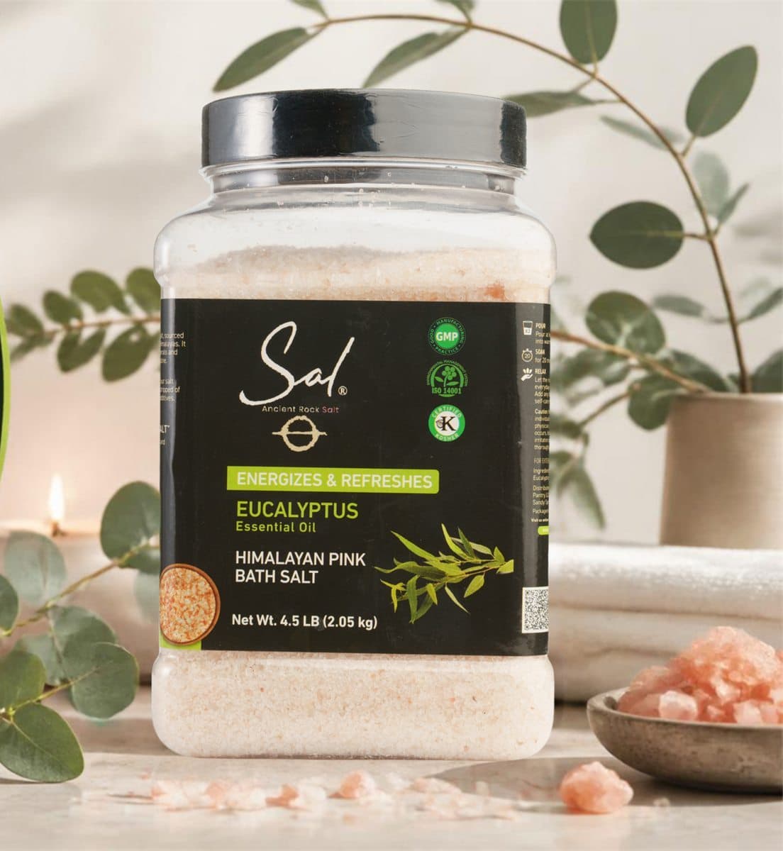 SAL Eucalyptus Bath Salt jar with eucalyptus branches and a towel